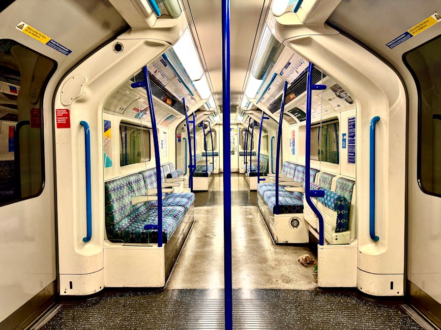 Nighttime view of Stanmore Tube Station platform with clean, dry tiled flooring and well-lit surroundings. The platform features wooden benches positioned near the edge, with modern overhead lighting